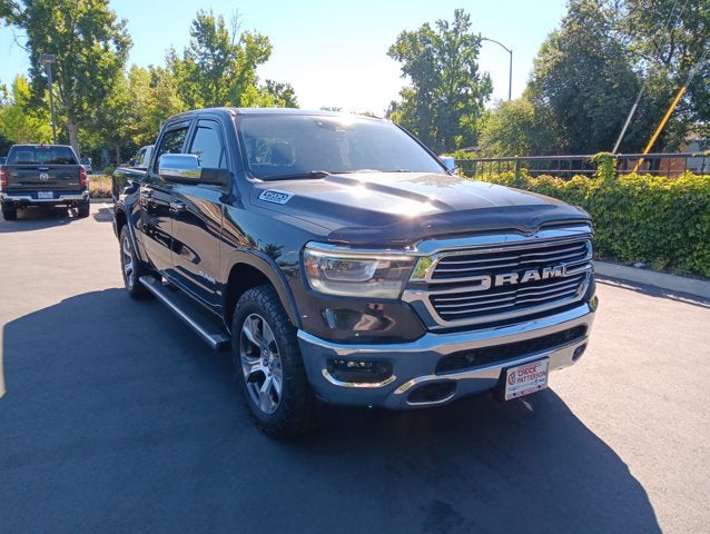 2022 RAM 1500 Laramie Crew Cab 4x4 5'7' Box in Diamond Black Crystal Pearlcoat — front three-quarter view