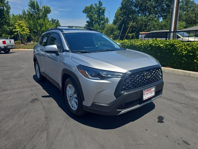 2022 Toyota Corolla Cross LE in Sonic Silver — front three-quarter view