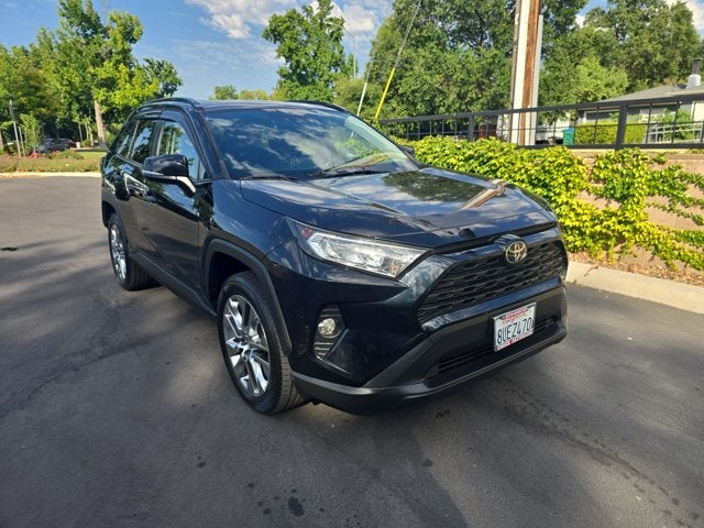 2021 Toyota RAV4 XLE Premium in Midnight Black Metallic — front three-quarter view